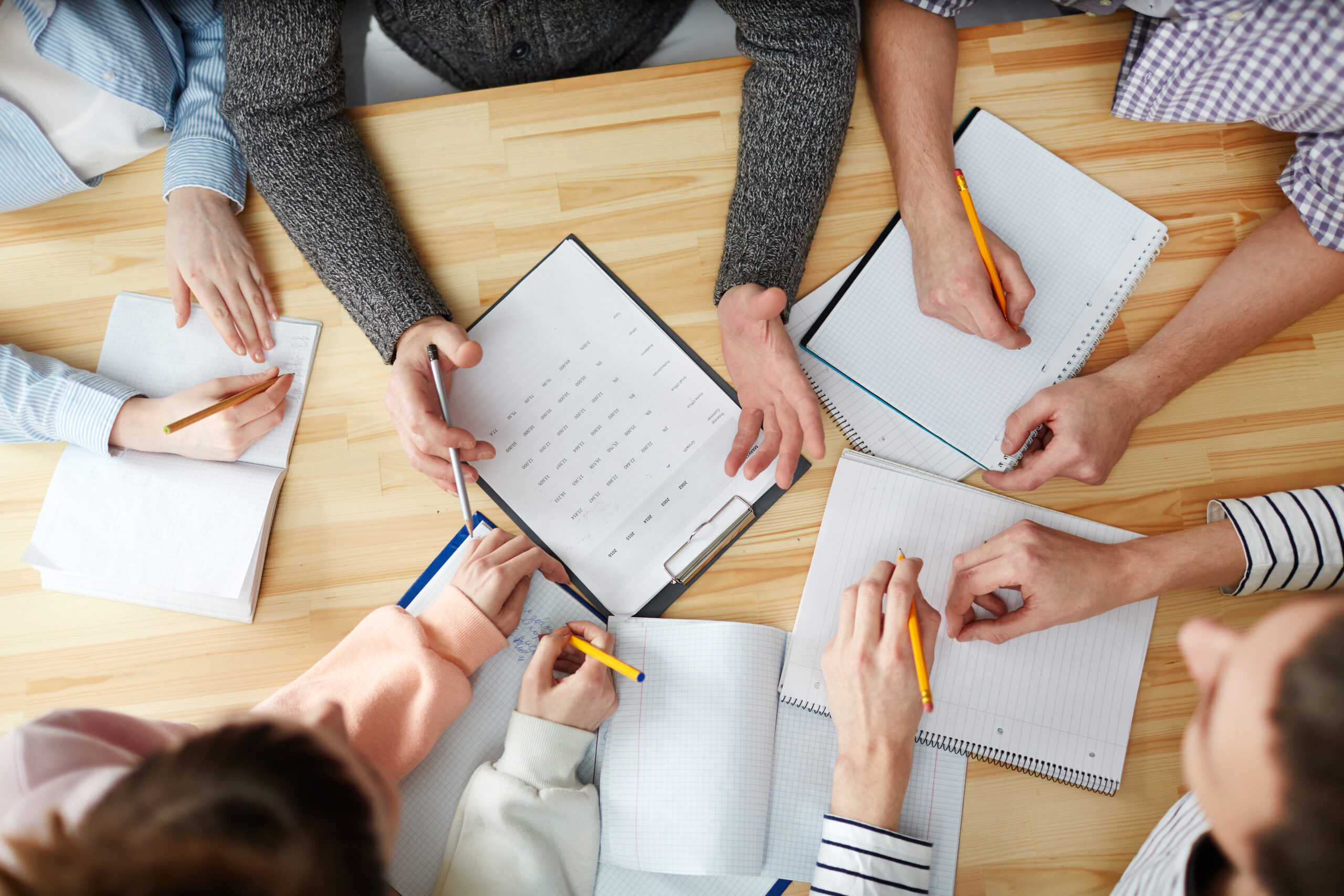 Overview,Of,Hands,Of,Students,Making,Notes,And,Teacher,Answering