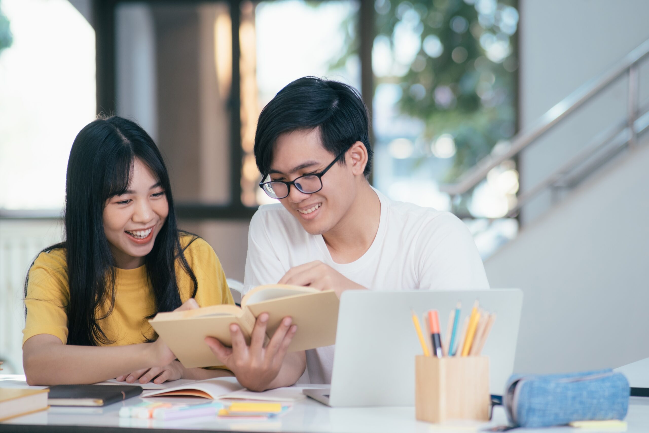 Young,Asian,University,Students,Are,Studying,For,An,Exam.,There